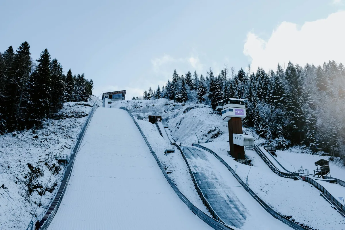 Ski jump surrounded by snow-covered trees (representative image)